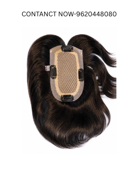 A dark brown hairpiece extension with a beige mesh attachment panel and black clips, shown against a plain white background with text at the top reading 'CONTACT NOW-9620448080'.