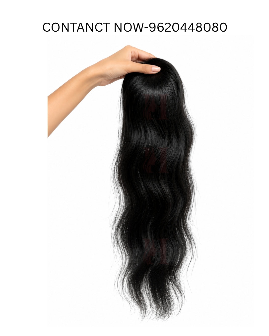 A hand holding up a long, wavy black hair extension or wig against a plain white background, with the text 'CONTACT NOW-9620448080' printed at the top.